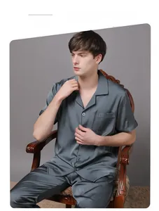 Detail of premium grey satin men's pajama set featuring silky texture and short sleeves