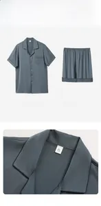 Close-up of lapel collar and button details on men's blue silk satin summer pajamas