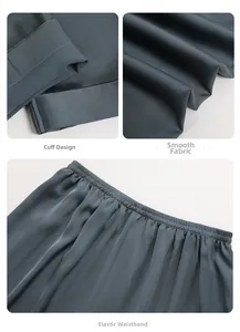 Detail of cuffs, smooth silk fabric and elastic waistband on men's blue satin pajamas