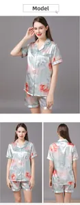 Detail of blue silk pajamas set with short sleeves and floral print for women