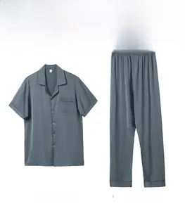Detailed flat lay of blue silk satin men's sleepwear set with short sleeves and trousers