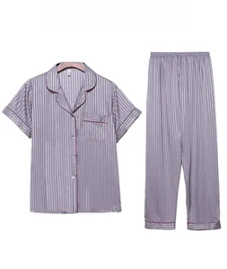 Detail view of purple striped satin pajama set featuring button-up shirt and long pants