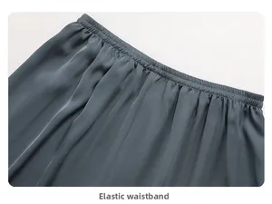 Detailed macro view of the elastic waistband on silky blue ice silk pajamas pants