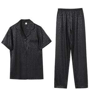 Black satin pajama set for women featuring short sleeves and leopard jacquard pattern