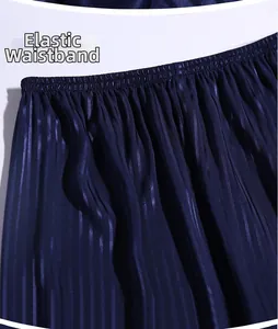 Close-up of dark blue striped satin pajamas featuring a flexible elastic waistband