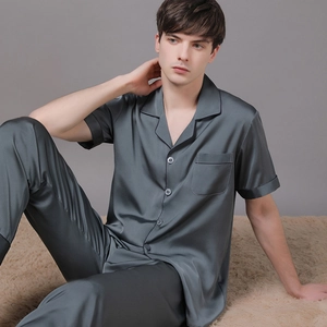 Men's dark grey satin pajama set featuring a short-sleeved top and long trousers