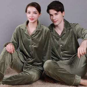 Olive green waffle knit couple's pajama set featuring button-up long sleeve tops and pants