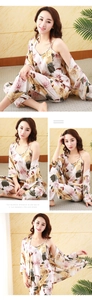 Detailed view of women's 3-piece floral faux silk pajamas set with robe and trousers