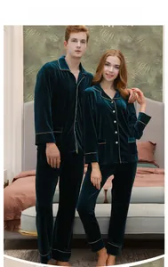Matching couple pajamas set in dark green velvet featuring classic contrast piping details