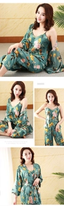 Detail of green floral faux silk pajama set featuring camisole, pants and robe