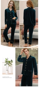 Detail view of dark green velvet pajama sets with golden piping and classic button-up collars
