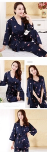 Detail view of navy blue silk pajama set featuring elegant flamingo prints and bird patterns