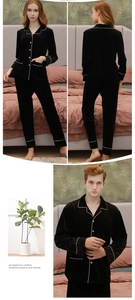 Detail of couple's velvet pajama set featuring white piping and notched collar design