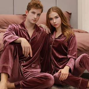 Velvet pajama set for couples with long sleeves and gold trim in dark mauve color