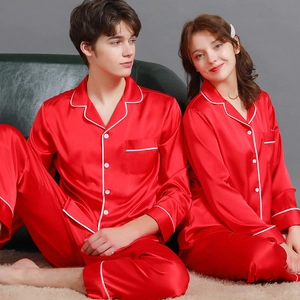 Classic red satin couple's pajama set with long sleeves and white contrast piping