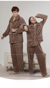 Close-up of thick flannel couple pajamas set with brown cable knit texture and soft finish