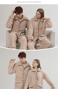Detail of warm flannel couple pajamas showing thick fleece texture and contrast piping trim