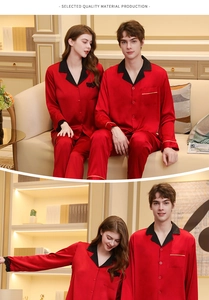 Detail of red silk couple pajamas with contrast black lapels and golden trim pocket