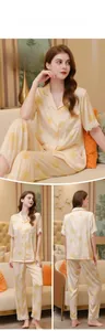 Detail of silk pajama set with floral prints and delicate white lace trim on cuffs