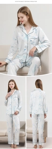 Detailed views of women's silk-like pajama set with blue floral prints and piping