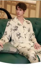 Detail of silk-like men pajamas featuring a black bamboo leaf print and smooth texture