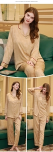Detail of champagne silk pajama set with leaf jacquard pattern and red piping accents