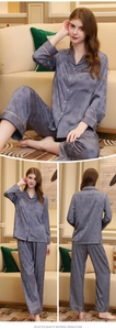 Detail of blue silk pajamas showing maple leaf pattern and golden piped collar edges