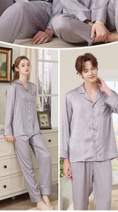 Detail of grey-purple silk pajamas showing wavy jacquard texture and piping trim