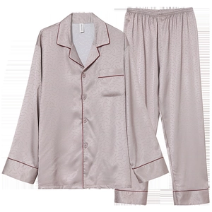 Pale pink silk satin pajamas set with heart patterns and red piping detail