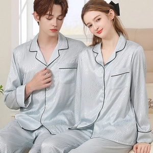 Couples silk satin pajamas set in silver blue with wave patterns and black piping trim