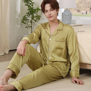 Men's avocado green silk pajama set with long sleeves and contrasting red piping detail