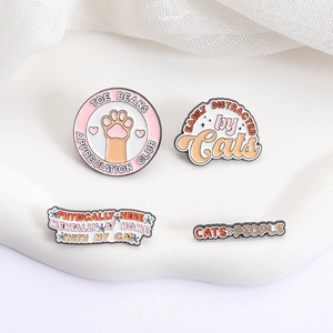 Cute cat-themed enamel pin set with witty text and paw designs for cat lovers