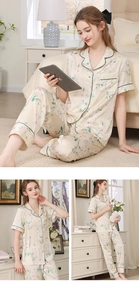Close-up of floral satin pajamas with short-sleeve button-up top and long trousers
