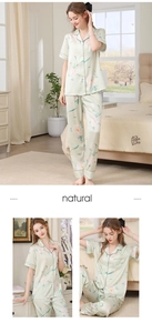 Detail of light green floral silk pajamas set with short sleeve top and long trousers