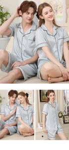 Détail d'un pyjama en soie argentée avec liseré noir et motif de vagues texturé