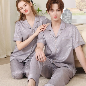 Matching lavender silk pajama sets for couples featuring short sleeves and long pants