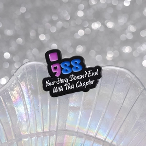 Mental health enamel pin with Your Story Doesn't End quote on rainbow shell background