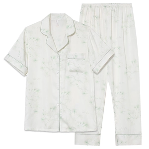 Women's silk-like pajamas set featuring short sleeves and long pants with floral patterns