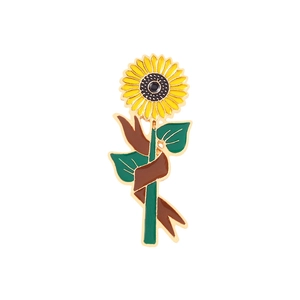 Cartoon sunflower enamel pin with yellow petals and green stem on white background