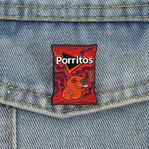 Creative Porritos enamel pin featuring a smoking bear on a blue denim jacket pocket
