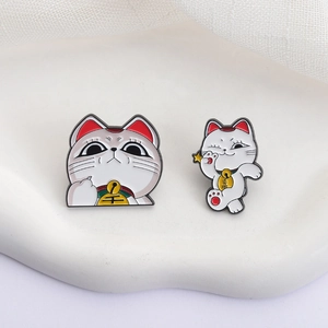 Cute white and red Maneki Neko lucky cat enamel pin set with gold bell detail