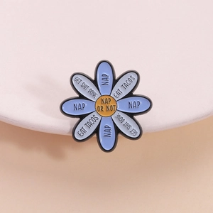 Cartoon flower enamel pin with fun slogans like NAP OR NOT on white ceramic tray