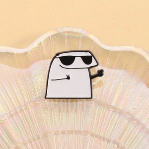 Funny cartoon enamel pin featuring a white character with sunglasses in a shell tray