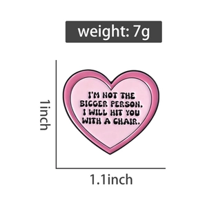Pink heart enamel pin with funny quote featuring product dimensions and weight