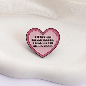 Funny pink heart enamel pin with quote 'I will hit you with a chair' for clothes