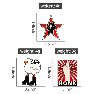 Detail view of cartoon enamel pins with SLAY goose and HONK graphics showing dimensions