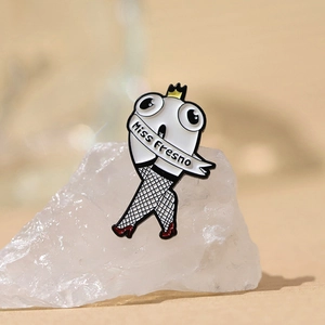 Miss Fresno creative crown badge pin with long legs in fishnet tights and red heels