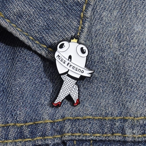 Creative cartoon tooth enamel brooch with crown and Miss Fresno sash on denim fabric