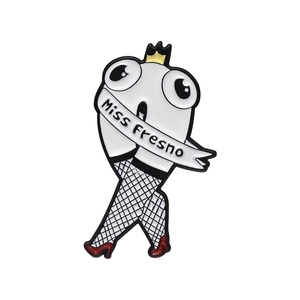 Cartoon Miss Fresno enamel brooch featuring white figure with red high heels and fishnet legs