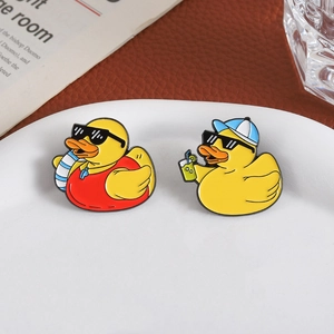 Cartoon yellow duck enamel pins with sunglasses and swim ring for beach vacation